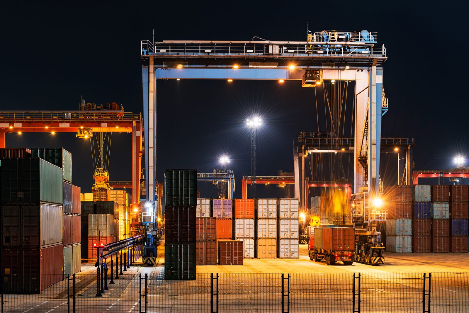 Industrial crane loading Containers in a Cargo freight ship